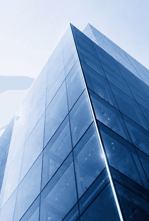 Glass skyscraper exterior photographed from below, illustrating enterprise scale and structure